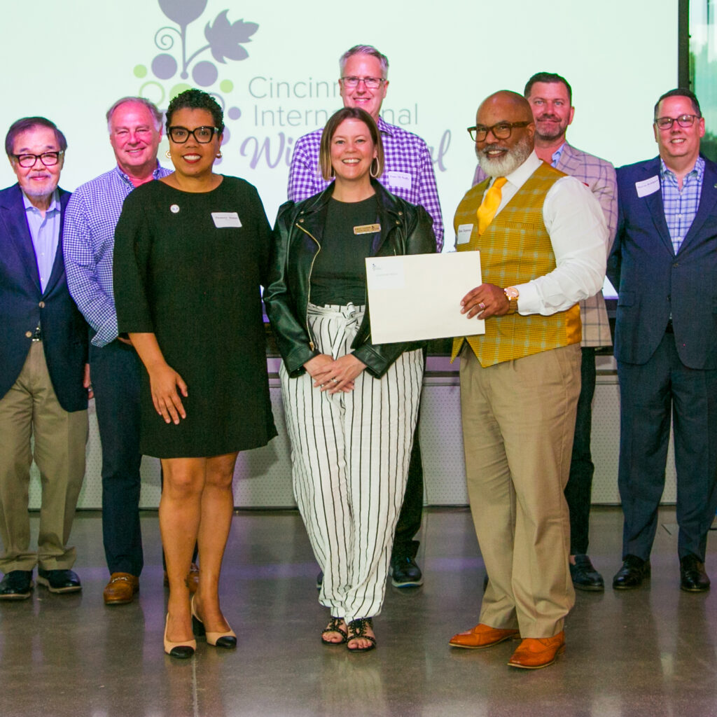 group of people receiving a check for their cause
